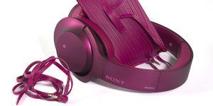 sony h.ear on pink headphones with sunglasses case