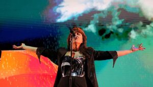 a woman singing into a microphone